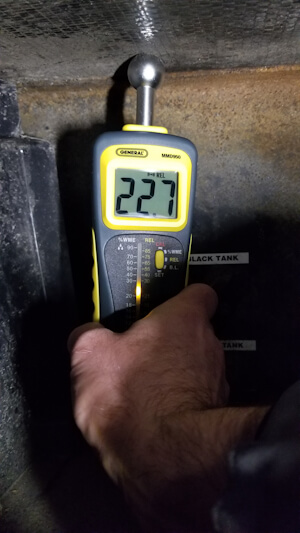 Moisture readings taken below the storage floor, above the waste water tank release area as seened in the picture on https://www.peerreviewedproducts.com